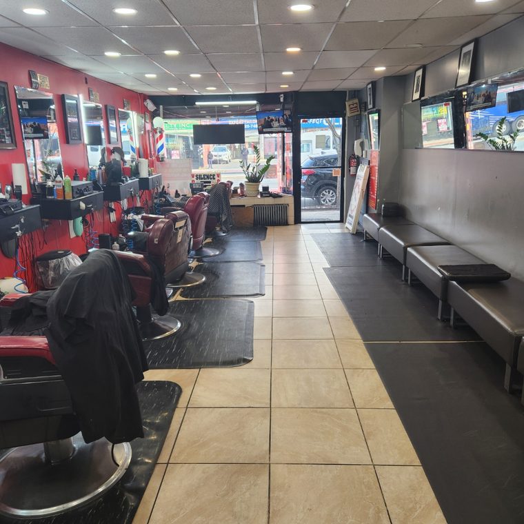 Barber chairs and waiting area at Lilacroix Barbers