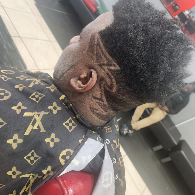 Flat-top cut with detailed hair design